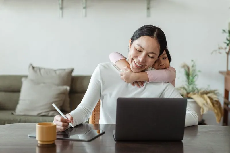 a woman sitting at a table working